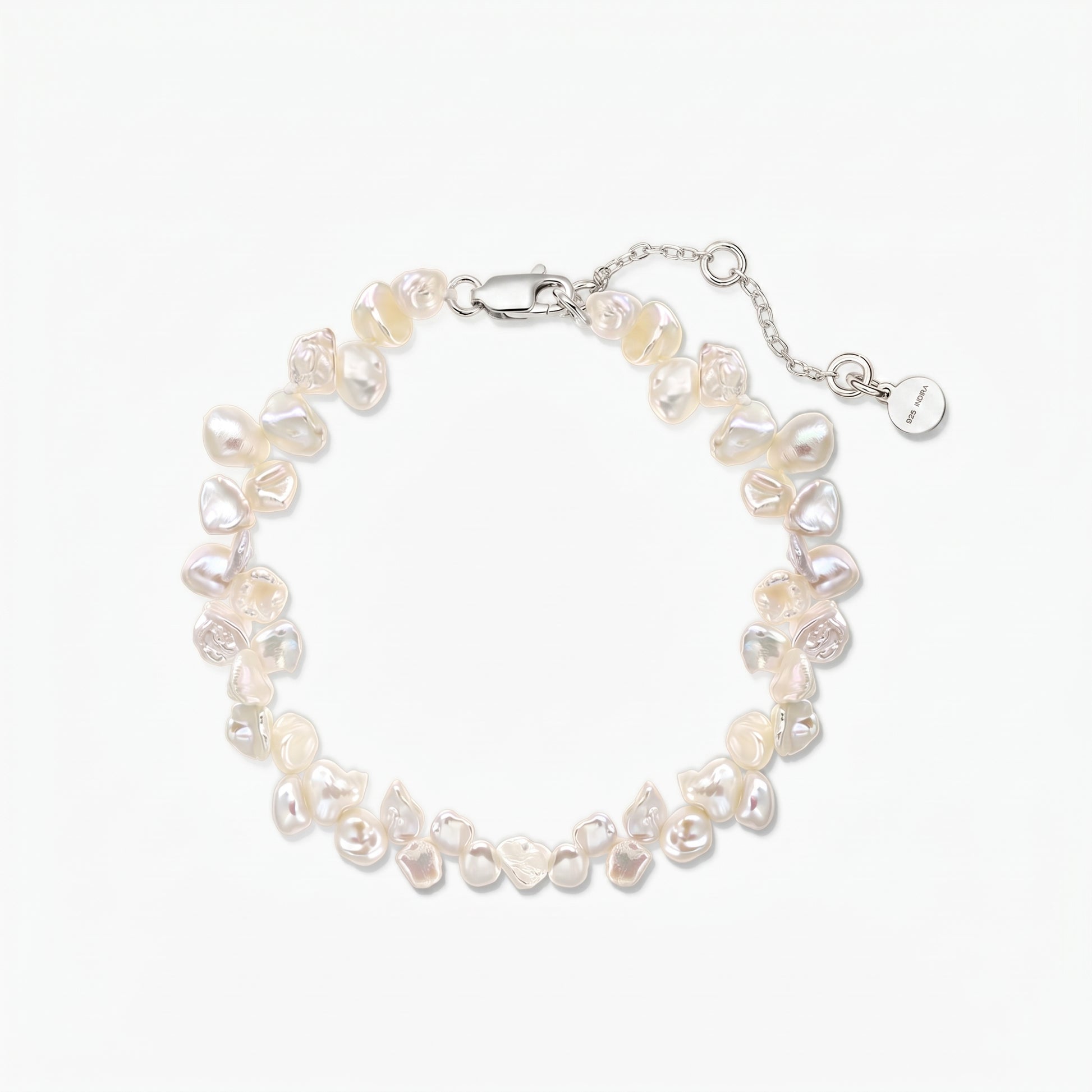 Elegant adjustable keshi freshwater pearl bracelet with a rhodium-plated 925 silver lobster clasp and extender chain on a white background.