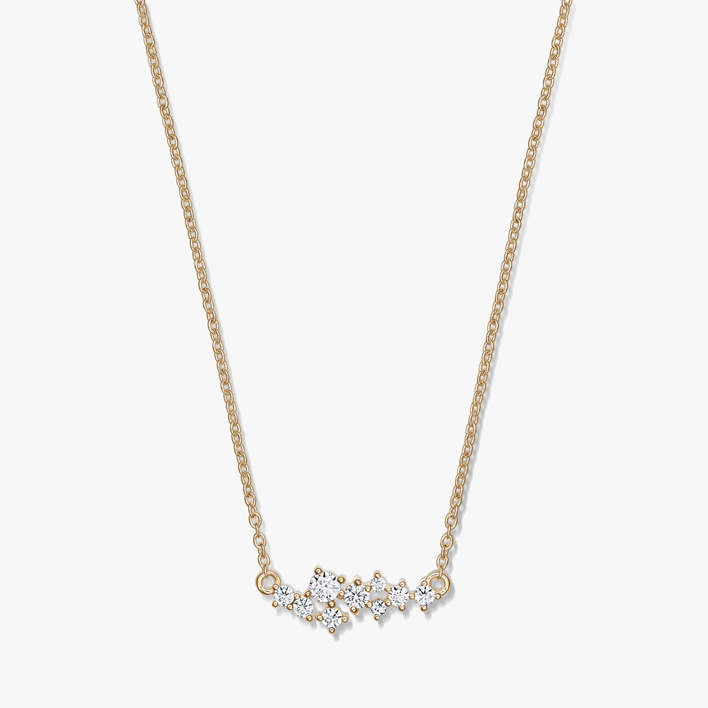 Elegant Golden Constellation silver necklace featuring a delicate chain and a starry cluster of clear stones, photographed on a white background.