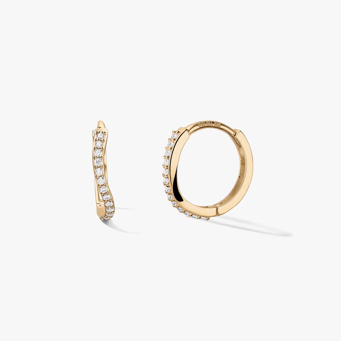 Pair of 14k yellow gold huggie hoop earrings with a wavy pavé row of white zirconia, shown on a clean white background—one side view and one open hoop to show the closure.