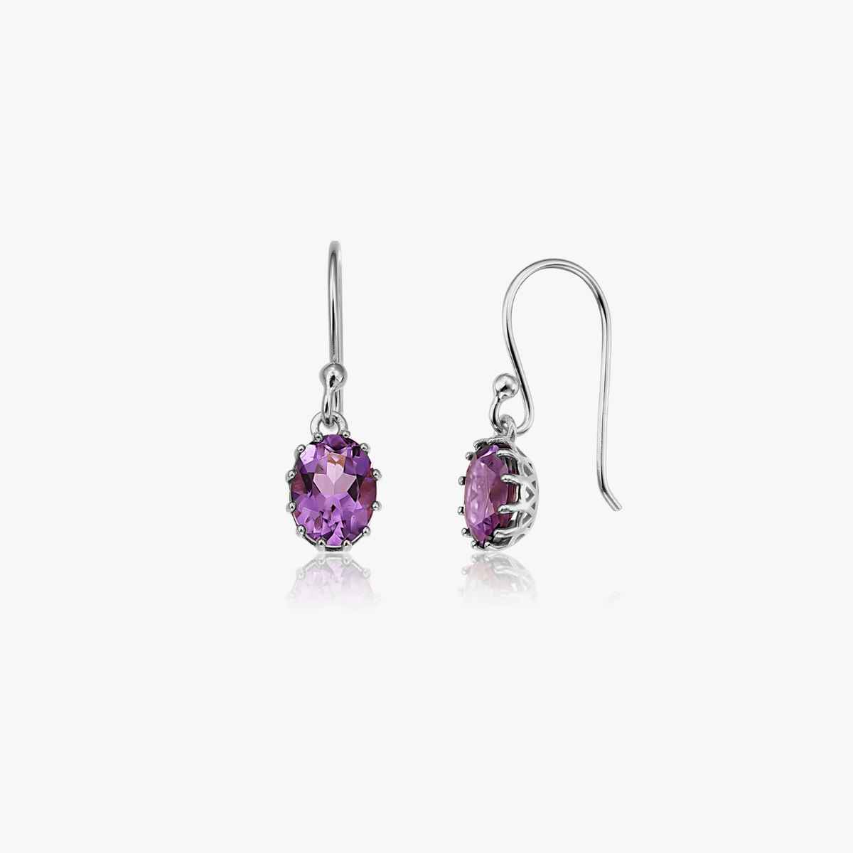 Pair of silver earrings featuring faceted purple amethyst stones against a white background.