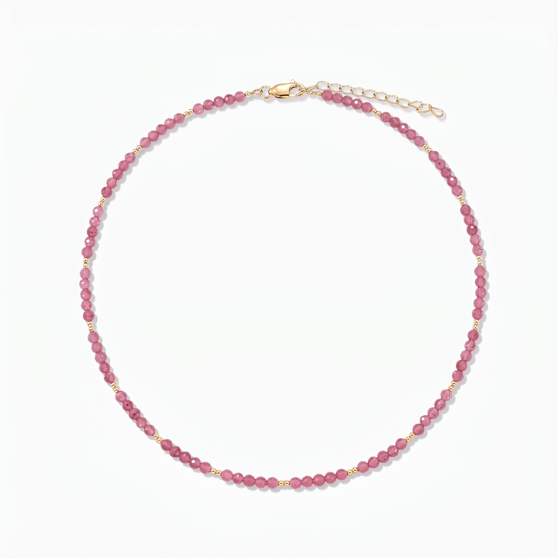 Silver Necklace Golden SummerScape - Tourmaline by Indira: a pink tourmaline beaded necklace with small gold accents and a lobster clasp with extender, on a white background.