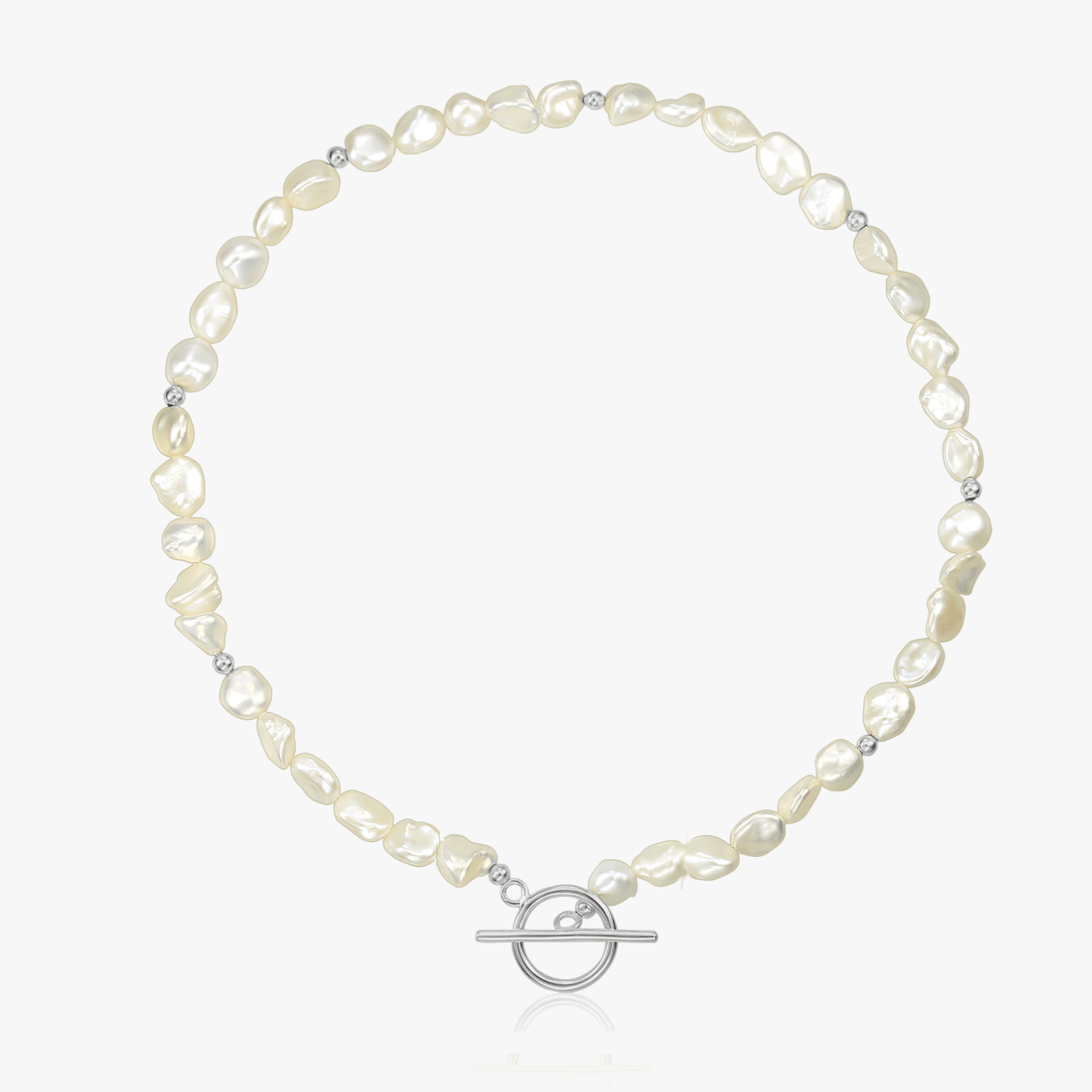 Silver necklace with natural pearls and a silver toggle clasp on a white background.