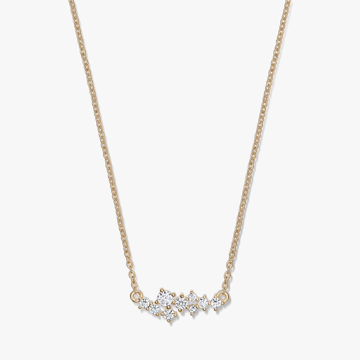 Elegant Golden Constellation silver necklace featuring a delicate chain and a starry cluster of clear stones, photographed on a white background.