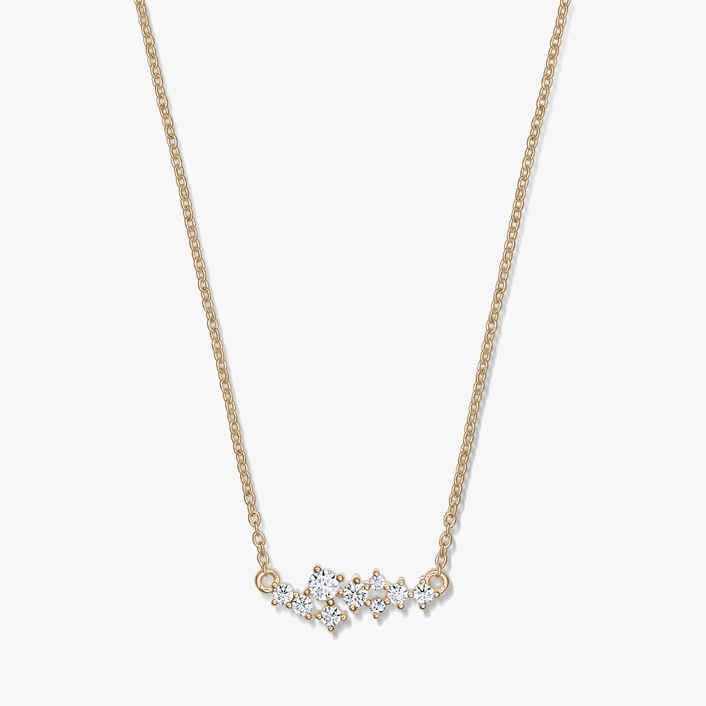 Elegant Golden Constellation silver necklace featuring a delicate chain and a starry cluster of clear stones, photographed on a white background.