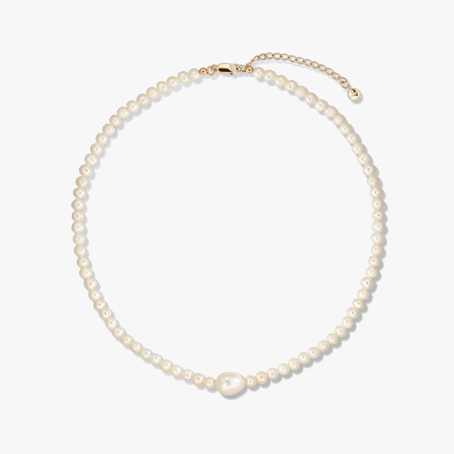 Golden Chanti silver necklace with white cultured pearls and an adjustable extender chain on a white background.