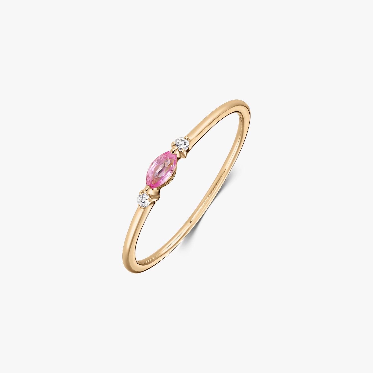 14k yellow gold ring featuring a marquise-cut pink sapphire between two small round natural diamonds on a white background.
