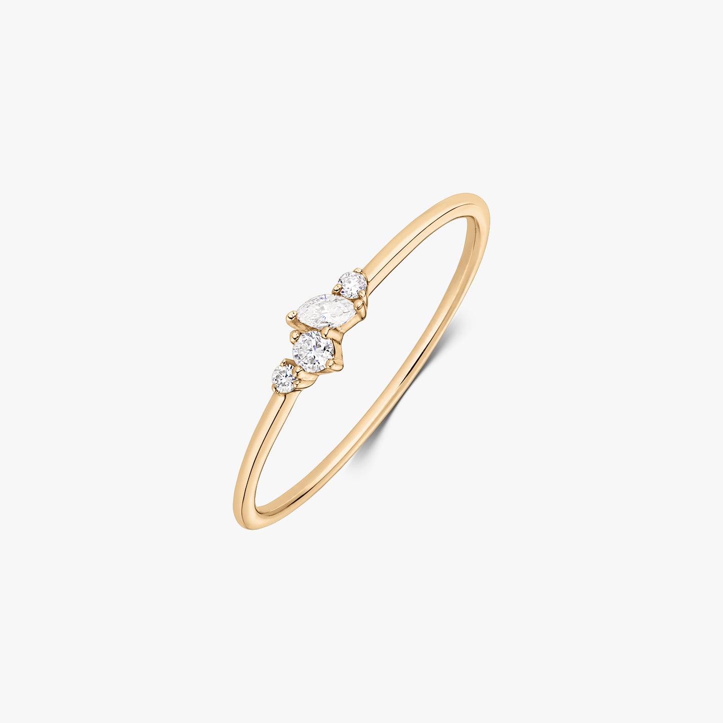 Nova 14K yellow gold ring featuring a delicate cluster of five white diamonds on a slim band, shown on a white background.