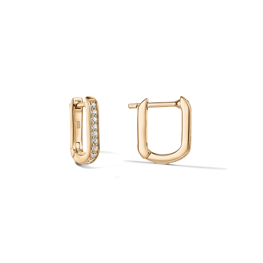 Pair of U-shaped huggie earrings in 925 silver with gold finish; one hoop pavé-set with clear zirconia, shown from front and side on a clean, transparent background.