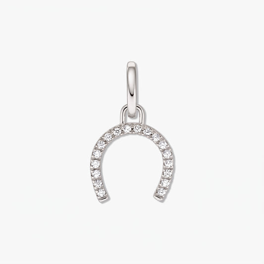 Sterling silver horseshoe pendant adorned with white zirconia stones on a white background.