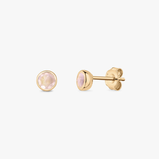 Pair of gold‑plated sterling silver stud earrings with round faceted rose quartz in bezel settings, shown on a white background (front and side views).