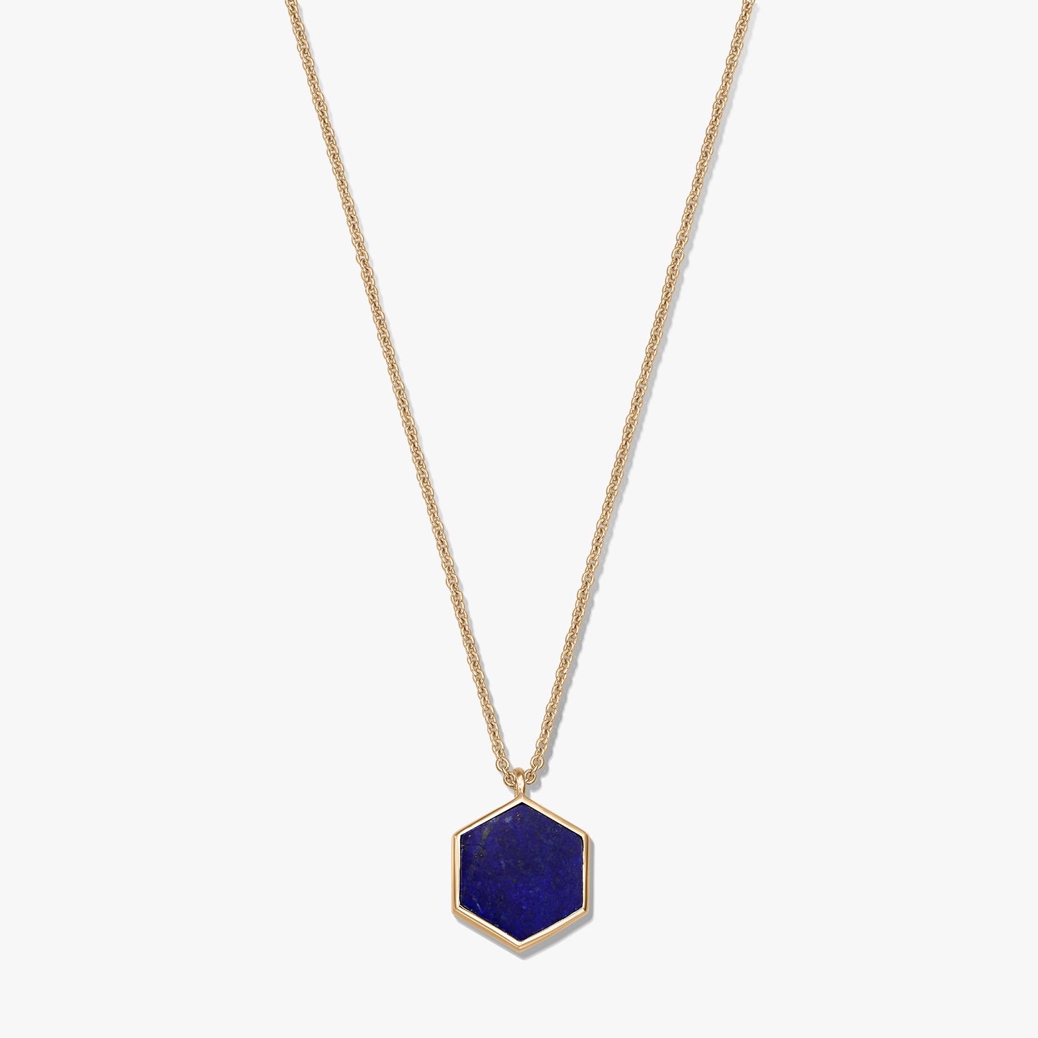Gold-plated sterling silver necklace featuring a hexagonal lapis lazuli pendant on a white background.