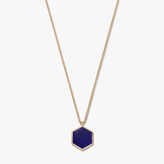 Gold-plated sterling silver necklace featuring a hexagonal lapis lazuli pendant on a white background.