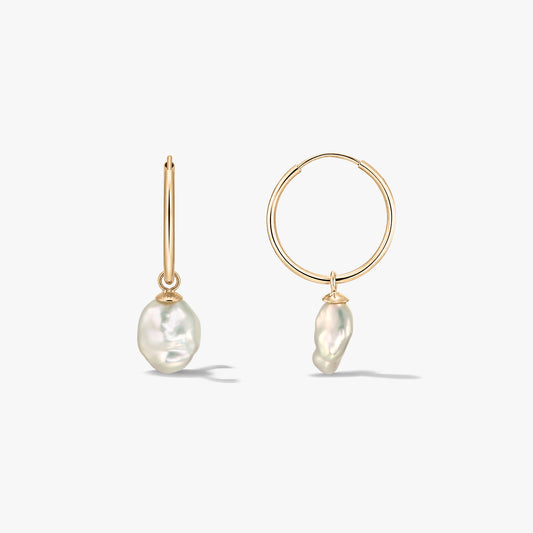 Pair of 14K yellow-gold hoop earrings with irregular natural pearl drops on a white background, shown in front and side views.