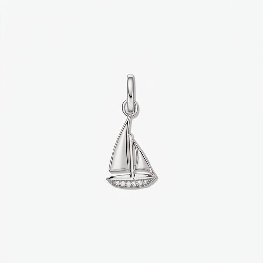 925 sterling silver sailboat-shaped pendant with white zirconia accents along the hull, isolated on a white background.