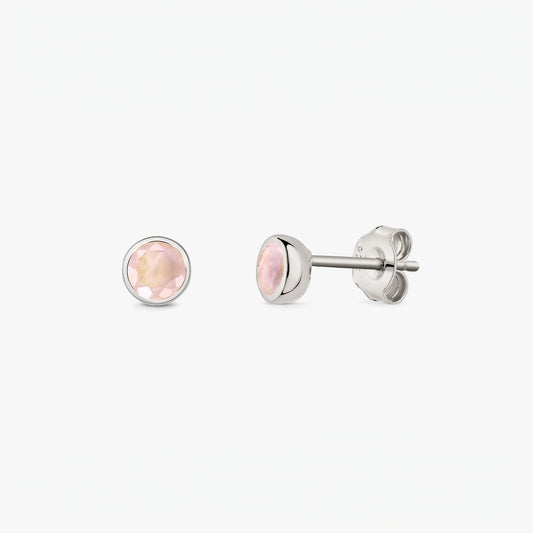 Elegant 925 sterling silver stud earrings featuring round faceted rose quartz, shown front and side on a white background with butterfly backs.