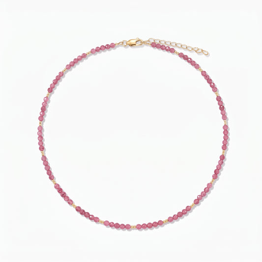 Silver Necklace Golden SummerScape - Tourmaline by Indira: a pink tourmaline beaded necklace with small gold accents and a lobster clasp with extender, on a white background.