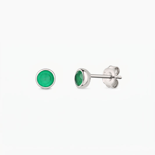 Elegant pair of silver stud earrings with bezel-set green onyx stones on a white background, shown from the front and side with butterfly backs.