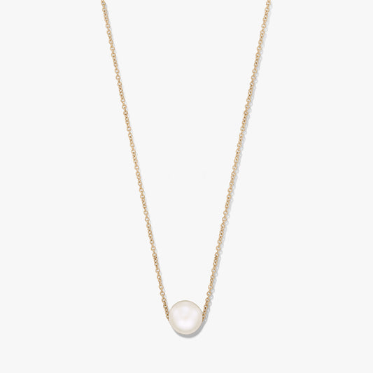 Elegant gold‑tone chain necklace featuring a single natural white pearl centered on the chain, isolated on a white background.