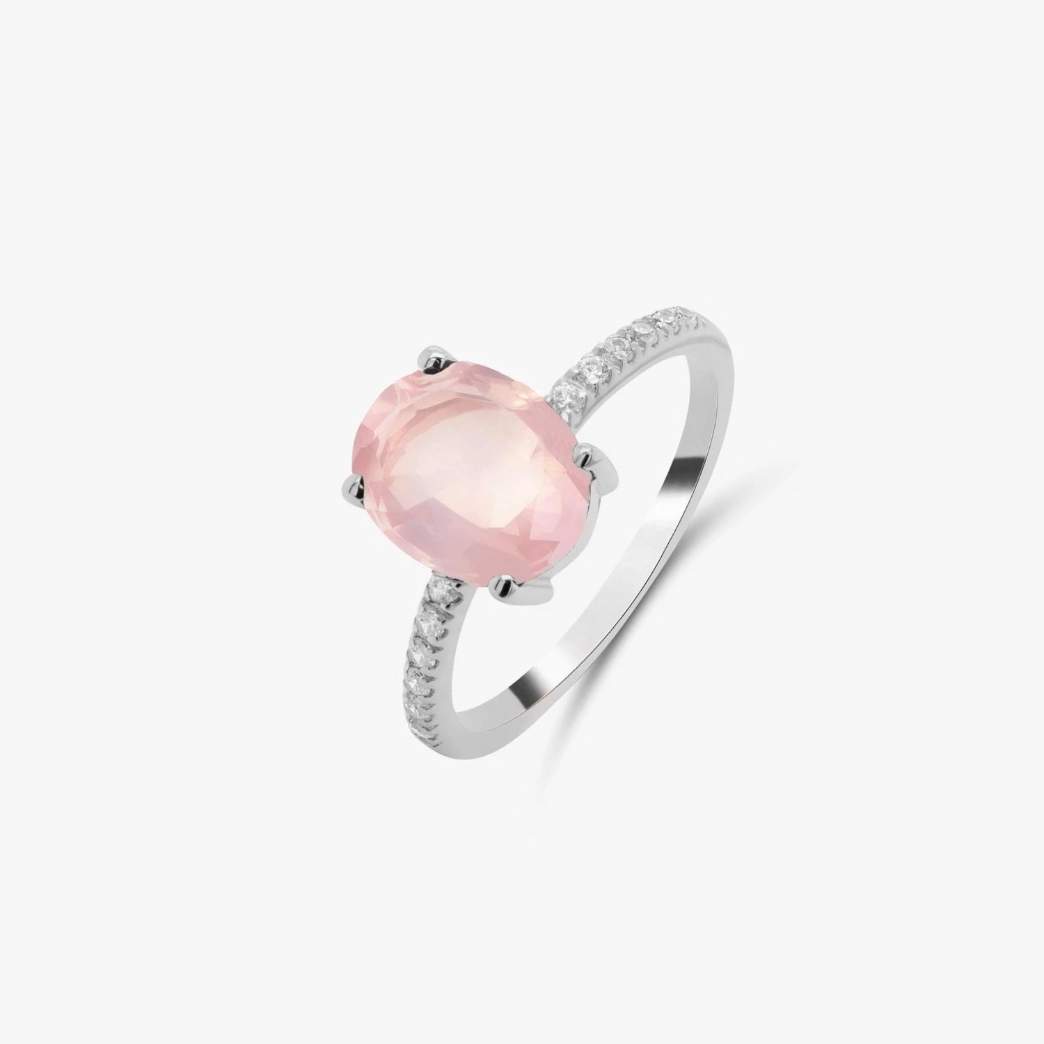 Silver ring featuring a rose quartz gemstone and small zirconia stones on a white background.